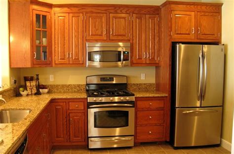 yellow oak cabinets and stainless steel appliances|old oak cabinets.